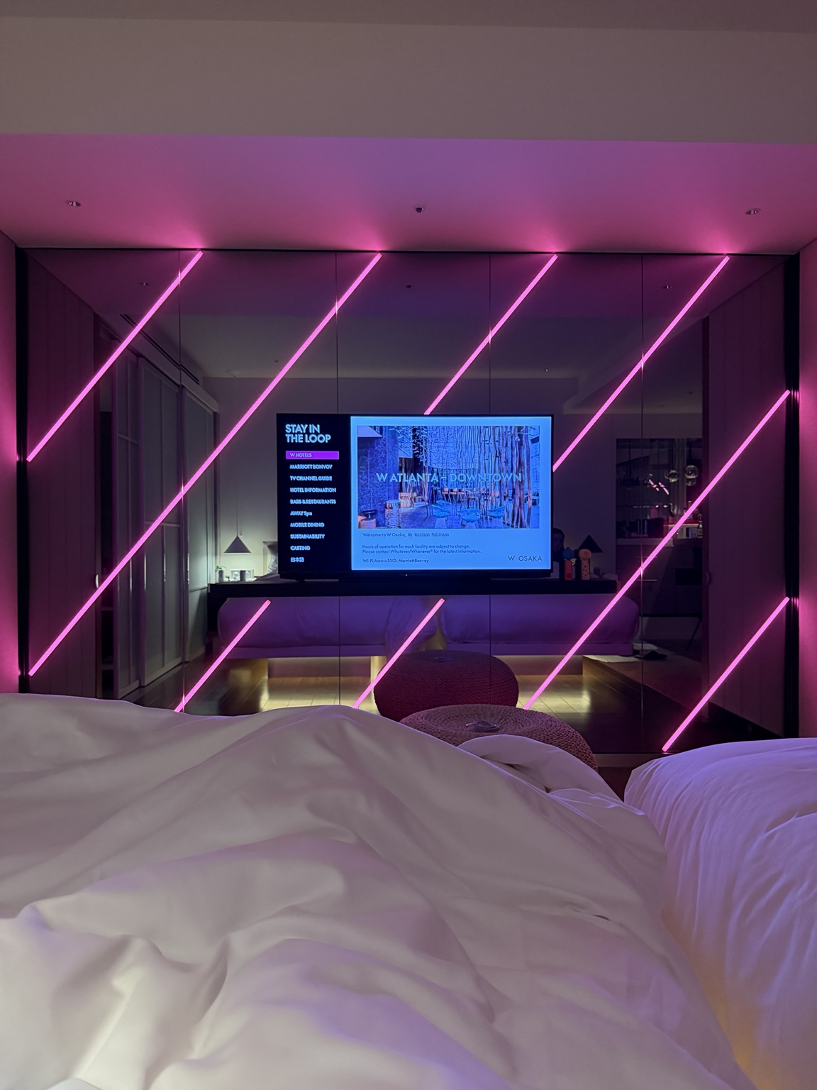Guest room at W Osaka with illuminated contemporary design