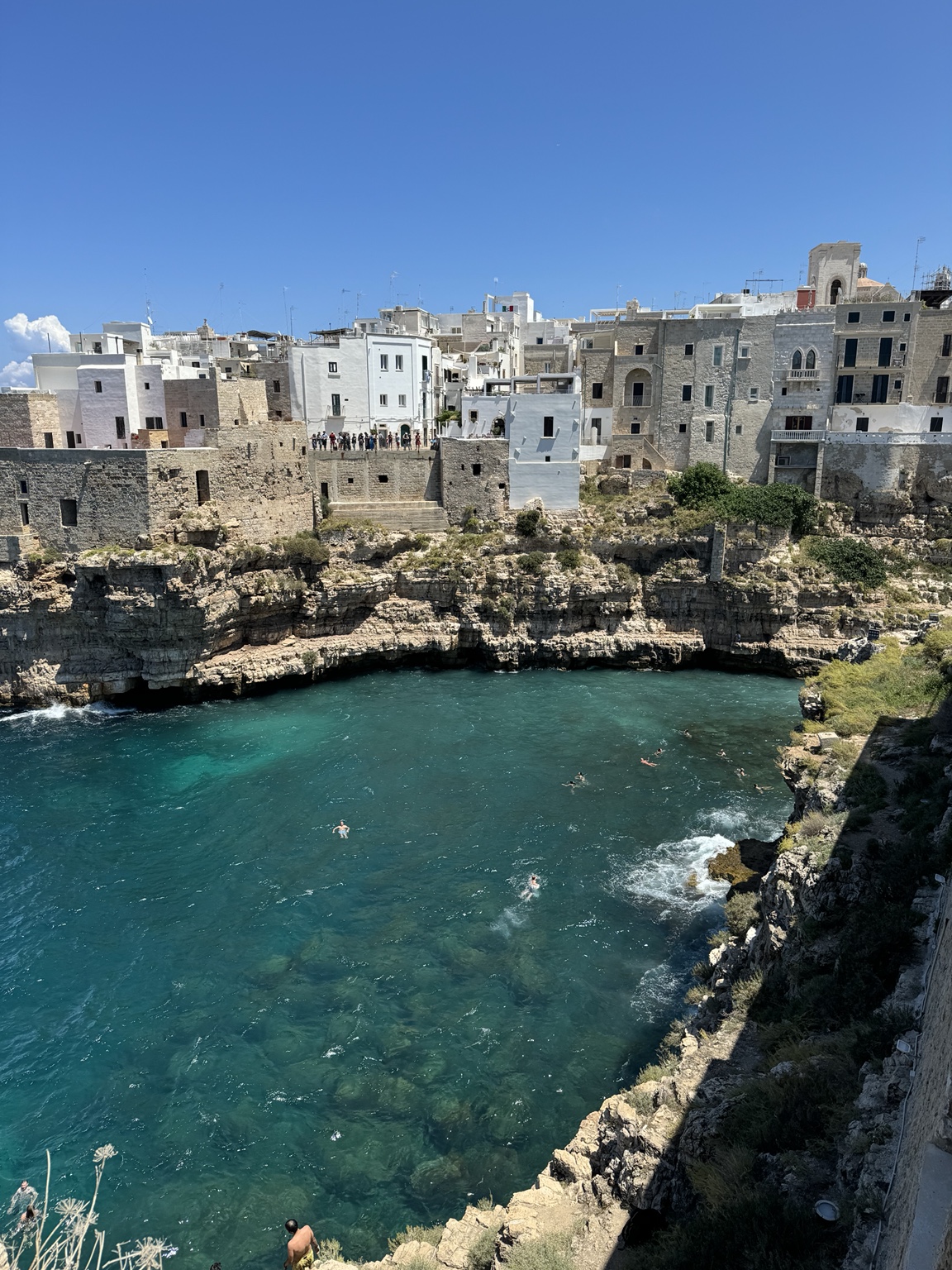 Whitewashed buildings above the Puglian coast