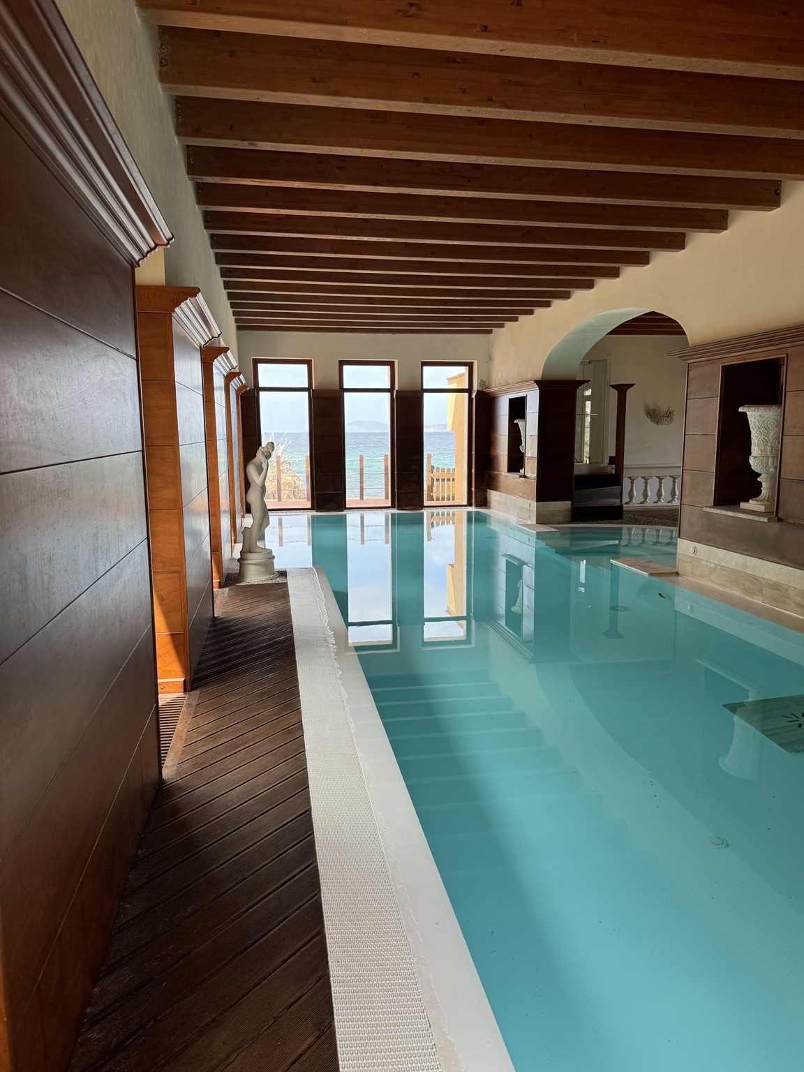 Indoor hotel pool overlooking the sea in Sardinia