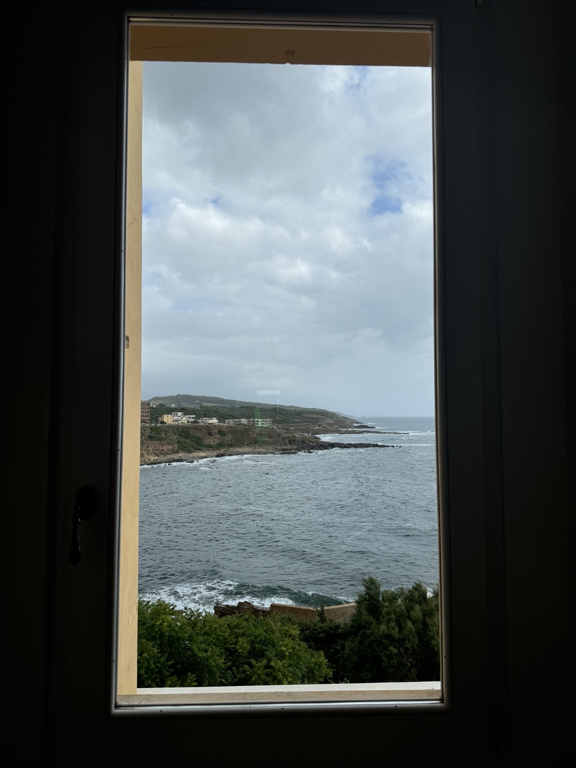 Sea view through a Sardinian hotel window
