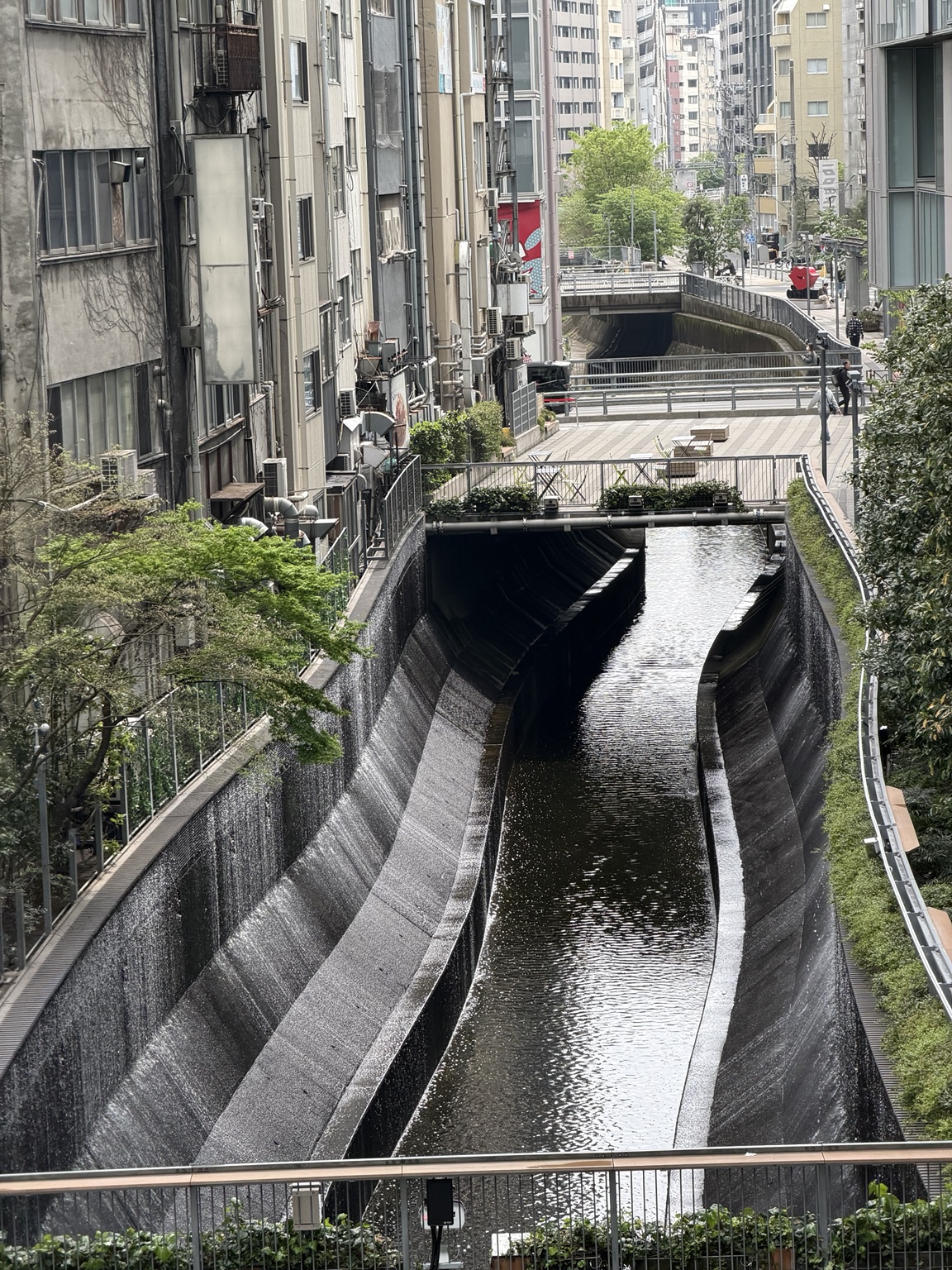 A quiet canal cutting through Tokyo